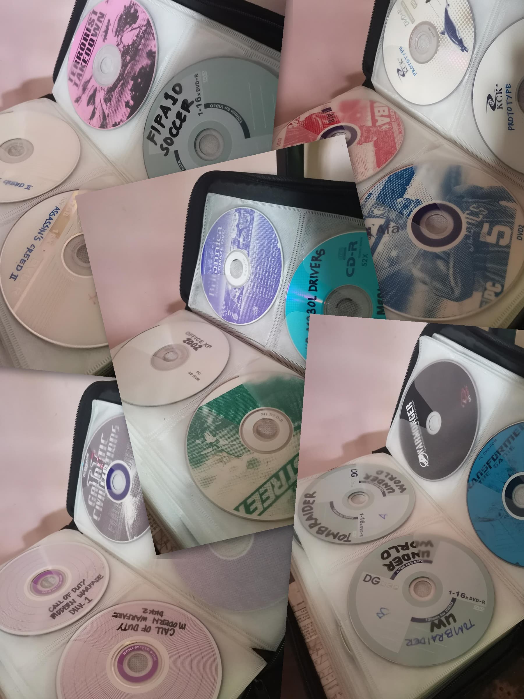 A collage of the family's old game discs in their CD binders: Assassin's Creed II, Prototype, Tomb Raider Underworld, Transformers, Call of Duty: Modern Warfare, and more